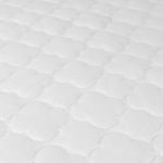 close up image of mattress pad pattern. 