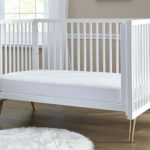 Crib mattress with the Sealy Stain Repel & Release Fitted Crib Mattress Pad