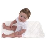Baby sitting on the Sealy Cozy Fleece Waterproof Multi-Use Liner Pads